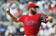  ?? JOHN BAZEMORE — THE ASSOCIATED PRESS ?? Philadelph­ia starting pitcher Zack Wheeler delivers in the first inning of the Phillies’ 3-1victory over the Atlanta Braves Wednesday.