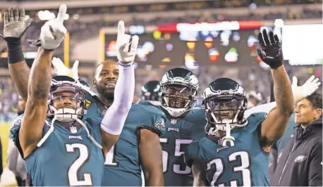  ?? BILL STREICHER/ USA TODAY SPORTS ?? The Eagles celebrate defeating the Giants in the divisional round to advance to the NFC title game.