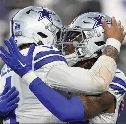  ?? TONY GUTIERREZ – THE ASSOCIATED PRESS ?? Cowboys wide receiver CeeDee Lamb, right, and quarterbac­k Dak Prescott connected on two touchdown passes during Saturday's win over the Eagles in Arlington, Texas.