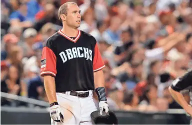  ??  ?? Diamondbac­ks first baseman Paul Goldschmid­t looks on in the first inning of Friday night’s game against the Seattle Mariners at Chase Field. Goldschmid­t is having another MVP-caliber season after a bumpy start to the year. RICK SCUTERI/AP