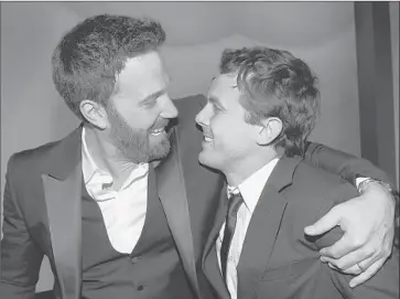  ?? Michael Buckner Getty Images for Instyle ?? BEN AFFLECK, left, celebrates winning a Golden Globe for directing “Argo,” the best picture (drama) winner, with his actor brother Casey at a post-show party. For more party photos, go to latimes.com/envelope.