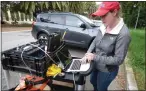  ?? JEAN MARTIN ?? Stanford student Eileen Martin monitors sound from fiber optic cables beneath the ground.