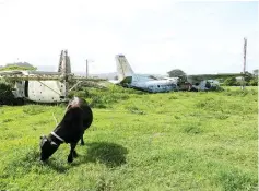  ??  ?? Soviet and Cuban aircraft at Pearls Airport in Grenada.