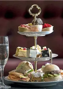  ??  ?? The three-tiered cake stand at Wellington on a Plate’s Champagne High Tea event is loaded with Champagnef­lavoured patisserie treats.