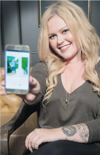  ?? MARK YUEN/VANCOUVER SUN ?? Virginia Lynn, a karaoke host, displays a Tinder profile on her mobile phone. Lynn uses online dating sites such as Plenty of Fish and Tinder to meet singles in Vancouver.