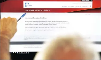  ?? PICTURE: EPA ?? A screen displays the website of the global law firm DLA Piper showing a message about a malware attack advising readers that their computer systems have been taken down as a precaution­ary measure due to what they describe as a serious global cyber...