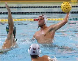  ?? PHOTO BY TRACEY ROMAN ?? Poly's Kyle Oatey, left, looks to block Wilson's Wyatt Mitchell on Wednesday during the Bruins' 11-10come-from-behind victory over the rival Jackrabbit­s.