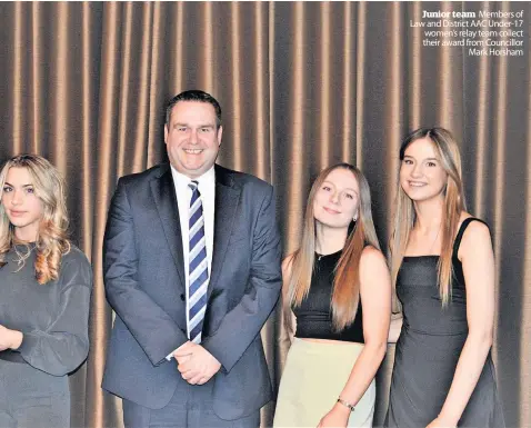  ?? ?? Junior team Members of Law and District AAC Under-17 women’s relay team collect their award from Councillor Mark Horsham