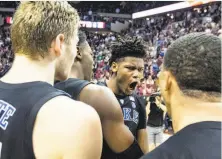  ?? Mark Wallheiser / Associated Press ?? Duke’s Cam Reddish, a freshman forward, reacts after his game-winning 3-pointer in the final second at Florida State.