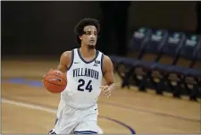  ?? ”
THE ASSOCIATED PRESS
R ?? Villanova’s Jeremiah Robinson-Earl didn’t let a broken nose or a mask keep him from leading the Wildcats to an 88-68 victory over Saint Joseph’s on Saturday night.