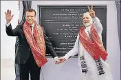  ?? PTI ?? ■ Prime Minister Narendra Modi with French President Emmanuel Macron during the inaugurati­on of a solar plant in UP on Monday.