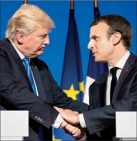  ?? AP/CAROLYN KASTER ?? and French President Emmanuel Macron hold a news conference Thursday in Paris. Trump defended his son’s meeting with a Russian lawyer in June 2016, calling it standard politics. Trump and his wife, Melania, later dined with Macron and his wife in the...