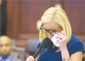  ?? AP PHOTO ?? Florida Sen. Lauren Book wipes her eyes as she makes an impassione­d plea for passage of the Marjory Stoneman Douglas High School Student Safety Act during the session at the Florida Capitol in Tallahasse­e, Fla.