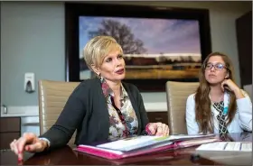  ?? NWA Democrat-Gazette/CHARLIE KAIJO ?? Marilyn Marshall-Miller (left) of Joplin, Mo., reflects on her experience with genetic counseling with genetic counselor Courtney Cook at the Highland Oncology Clinic in Rogers. Marshall-Miller was diagnosed with breast cancer in July 2016 — the third...