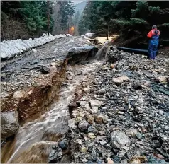  ?? MATT BORON/ ALASKA DEPARTMENT OF TRANSPORTA­TION VIA AP ?? Heavy rains caused mudslides up to 600 feet wide in Haines, Alaska, on Wednesday. Authoritie­s say six people are missing and four homes were destroyed in the slide.