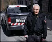  ?? MATT SLOCUM - THE ASSOCIATED PRESS ?? Lansford Police Chief Jack Soberick stands next to his truck, Friday, March 12, 2021, in Lansford, Pa. On May 26, 2020, police found 9-year-old Ava Lerario; her mother, Ashley Belson, and Ava’s father, Marc Lerario, fatally shot inside their home. Soberick was the first to respond to the scene. “I don’t believe this would have happened this way if not for the pandemic pushing him beyond the brink,” Soberick said of Marc Lerario. “I wish Marc would have gotten treatment for the bipolar disorder.”