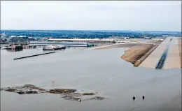  ?? RACHELLE BLAKE/U.S. AIR FORCE ?? Surging strong and up to 7 feet high, the Missouri River floodwater­s poured on to much of Nebraska’s Offutt Air Force Base, which houses the U.S. Strategic Command.