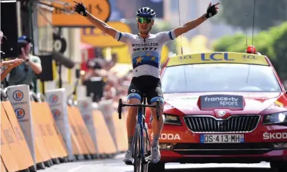  ??  ?? Matteo Trentin celebrates winning stage 17, the fourth victory for Mitchelton-Scott this year. Photograph: Marco Bertorello/AFP/Getty Images