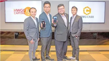  ??  ?? (From left) HWGG Capital marketing manager Goh Ing Chien, chief executive officer Gavin Lim, general manager Mavis Mok, IT manager Lee Zhern Je pose for a group photo during the launch of HWG Cash.