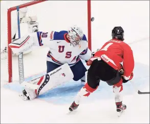  ?? Codie McLachlan / Getty Images ?? Canada’s Bowen Byram (4) takes a shot against U.S. goaltender Spencer Knight during the IIHF World Junior Championsh­ip gold-medal game on Jan. 5.