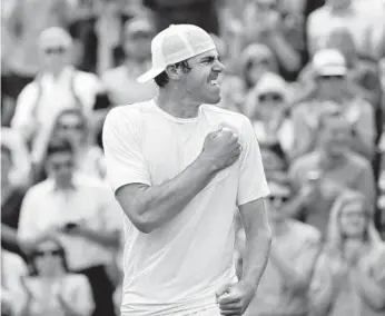  ?? BEN CURTIS/AP ?? Reilly Opelka celebrates after beating Stan Wawrinka in a singles match during Day 3 of the Wimbledon on Wednesday,