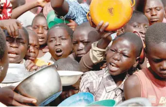  ??  ?? Internally displaced people wait for food distributi­on at an internally displaced persons (IDP) camp in Bunia, Ituri province, eastern Democratic Republic of Congo. — Reuters