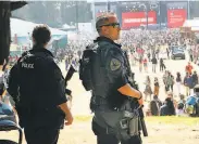  ?? Paul Kuroda / Special to The Chronicle ?? Members of San Francisco Police Department’s SWAT team monitor the crowd in the soccer field Sunday at Outside Lands in Golden Gate Park.