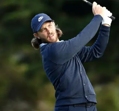  ?? Ezra Shaw/Getty Images ?? Tommy Fleetwood is in position to win his first major at two shots back of leader Li Haotong.