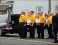  ??  ?? Members of the Ulster County Sheriff’s Office dive team carry the casket of Sgt. Kerry Winters, a member of the team, outside St. Joseph’s Roman Catholic Church in Glasco on Thursday.