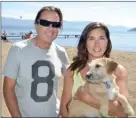  ?? RON SEYMOUR/Courier Extra ?? Kelowna residents Andrew and Marla O’Brien visit the Lake Avenue beach access with Coco.