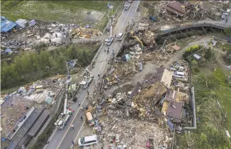  ?? Carl Court / Getty Images ?? Buildings lie in ruins after being hit by a tornado shortly before the arrival of Typhoon Hagibis. The death toll climbed as high as 33 as Hagibis delivers a torrent of rain and powerful wind.