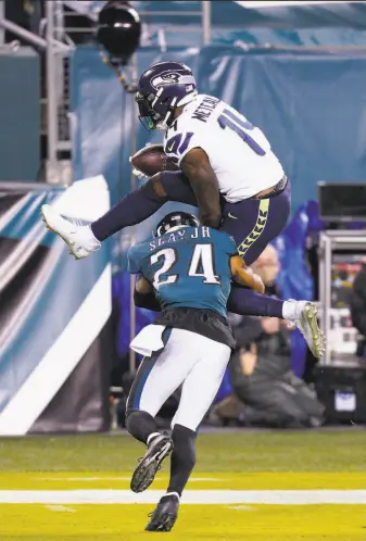  ?? Chris Szagola / Associated Press ?? Seahawks wide receiver DK Metcalf beat Eagles cornerback Darius Slay Jr. much of the night, reeling in 10 passes for 177 yards. This season he has 58 catches for 1,039 yards and nine TDs.