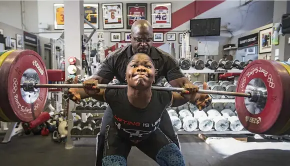  ?? BERNARD WEIL PHOTOS/TORONTO STAR ?? Maya Laylor gets a helping hand from her dad Clance at a recent training session. Laylor hones her craft at her father’s gym in downtown Toronto.