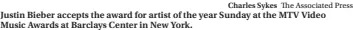  ?? Charles Sykes The Associated Press ?? Justin Bieber accepts the award for artist of the year Sunday at the MTV Video Music Awards at Barclays Center in New York.