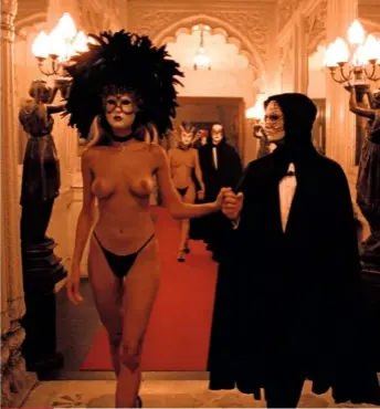  ??  ?? Above:
The ‘Mysterious Woman’ (Abigail Good) and Harford enter the party. Right: Leon Vitali was actually Kubrick’s personal assistant at the time, but after much searching the director gave him the key Red Cloak role. Bottom:
Filming the sinister partygoers — Kubrick was intrigued by the notion of secret societies.