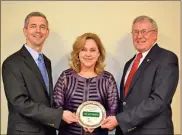  ?? County Chamber of Commerce
/ Gordon ?? Assistant City Administra­tor Paul Worley (left) stands with Chamber President Kathy Johnson and Mayor Jimmy Palmer as the city’s Legacy Award is displayed.