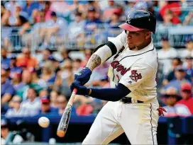  ?? DANIEL SHIREY / GETTY IMAGES ?? Johan Camargo drove in the Braves’ first run in the first inning and added an RBI single in the sixth inning against the Rockies on Sunday at SunTrust Park. The Braves collected only six hits in losing 4-2.