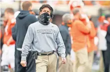  ??  ?? Oklahoma State coach Mike Gundy wants his players to wear their masks and keep their distance as much as possible, but he knows that can't eliminate all the COVID risks. [BRYAN TERRY/ THE OKLAHOMAN]