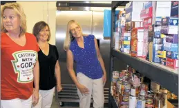  ??  ?? Jennifer Batts and Evelyn Lawrence, directors, and Debbie Bennett, food pantry manager, tour the Good Shepherd Food Pantry at Saint Mary Catholic Church, Newport in Charlotte Hall. The effort began after the Rev. Michael Briese took the helm at the...