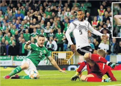  ?? PHOTOS: ACTION IMAGES VIA REUTERS ?? Inelegant but effective . . . Germany’s Manuel Neuer makes a save from Northern Ireland’s Conor Washington during their European Championsh­ip qualifier yesterday. Inset: Washington reacts.