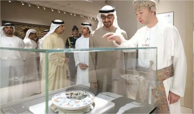  ?? ?? ±
Sheikh Mohamed being briefed about the artifacts during his visit to the National Museum in Muscat on Wednesday.