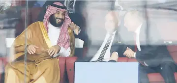  ?? AP PHOTOS ?? Saudi Arabia Crown Prince Mohammed bin Salman (left), FIFA President Gianni Infantino (centre) and Russian President Vladimir Putin in discussion during the game.