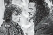  ?? ?? Los actores John Bell y Luke Evans, en una imagen de la cinta que completa la trilogía de Peter Jackson ‘El Hobbit’.