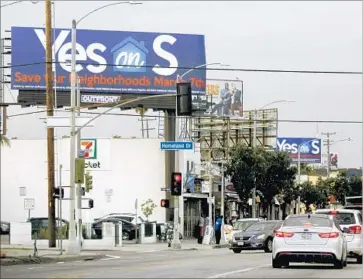  ?? Francine Orr Los Angeles Times ?? LOS ANGELES VOTERS go to the polls Tuesday to weigh in on Measure S and other local issues. Above, a billboard on Crenshaw Boulevard supports the measure, which would limit real estate developmen­t in L.A.