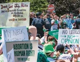  ?? J. SCOTT APPLEWHITE/AP ?? Abortion-rights activists demonstrat­e Thursday on Capitol Hill in Washington against the Supreme Court’s reversal of Roe v. Wade. President Joe Biden said Thursday he would support an exception to the Senate filibuster to protect abortion access.