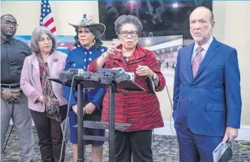  ?? PEDRO PORTAL pportal@miamiheral­d.com ?? From left, Miami-Dade County Mayor Daniella Levine Cava, Congresswo­man Frederica Wilson, U.S. Department of Housing and Urban Developmen­t Secretary Marcia Fudge and Miami-Dade County Homeless Trust Chairman Ron Book talk to reporters on Wednesday during a tour of an assistance center for homeless people in downtown Miami.