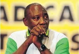  ??  ?? Newly elected African National Congress president Cyril Ramaphosa becomes emotional after it was announced Monday he had won the ANC leadership.