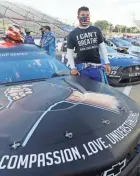  ?? STEVE HELBER/AP ?? Bubba Wallace waits for the start of a NASCAR Cup Series auto race in Martinsvil­le, Va.