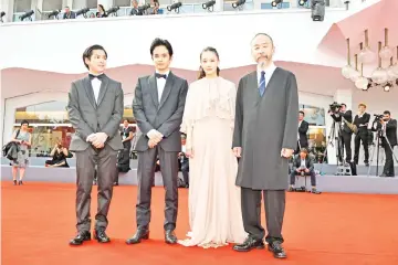  ?? — AFP photo ?? (From left) Actor Ryusei Maeda, actor Sosuke Ikematsu, actress Yu Aoi and director and actor Shinya Tsukamoto arrive for the premiere of the film 'Zan' (Killing) presented in competitio­n on Sept 7 during the 75th Venice Film Festival at Venice Lido.