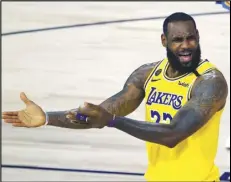  ?? Associated Press ?? COME ON! — LeBron James of the Lakers reacts to a call against the Oklahoma City Thunder during the second half on Wednesday in Lake Buena Vista, Fla.